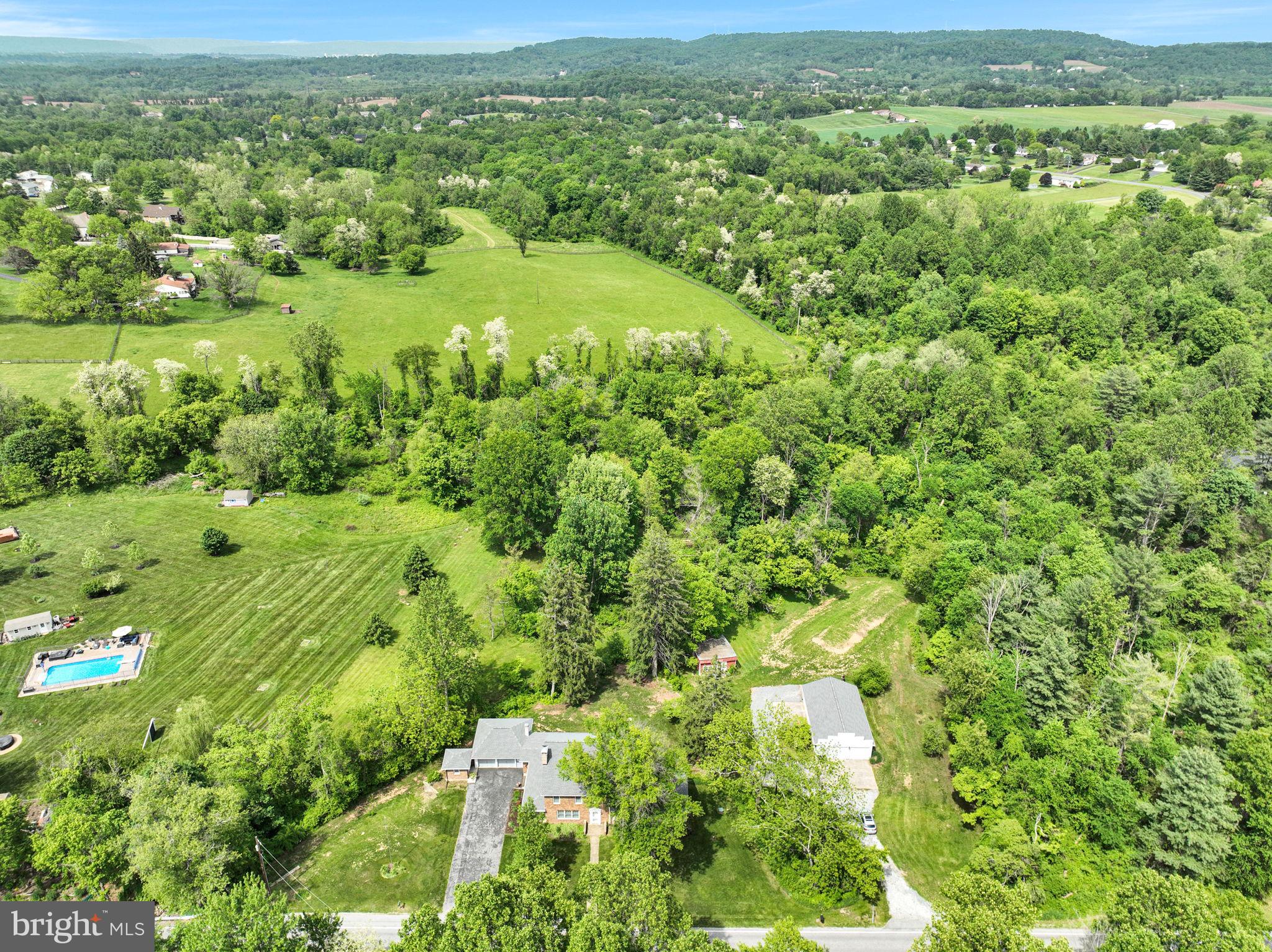 1037 Siddonsburg Road Lewisberry, PA 17339 - Photo 49 of 61 a view of a lush green field with a houses