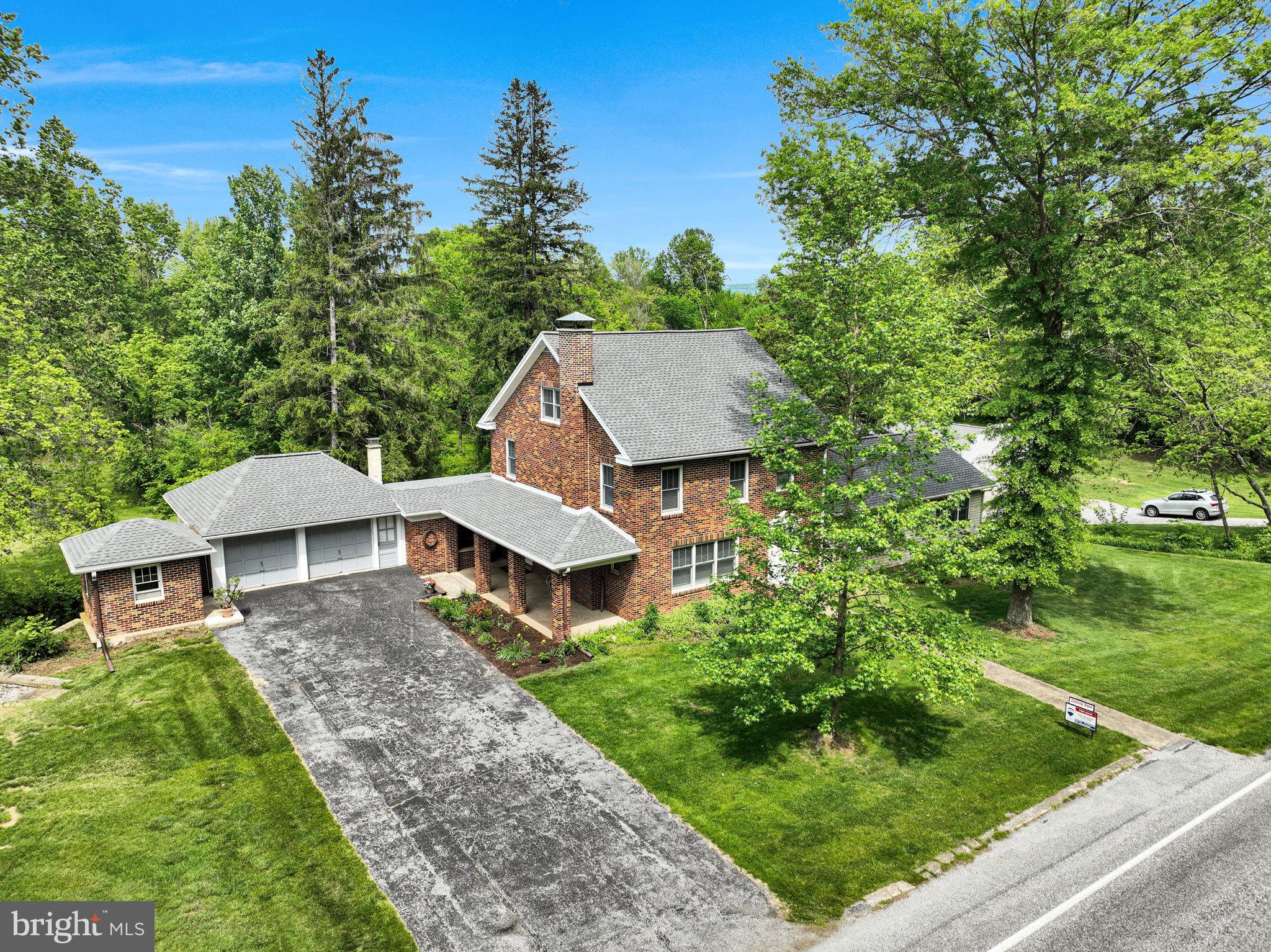 1037 Siddonsburg Road Lewisberry, PA 17339 - Photo 5 of 61 a view of a house with a yard and trees