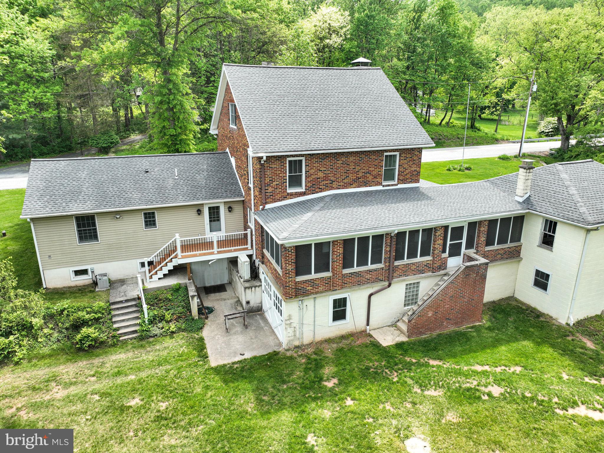 1037 Siddonsburg Road Lewisberry, PA 17339 - Photo 52 of 61 a aerial view of a house with a yard table and chairs