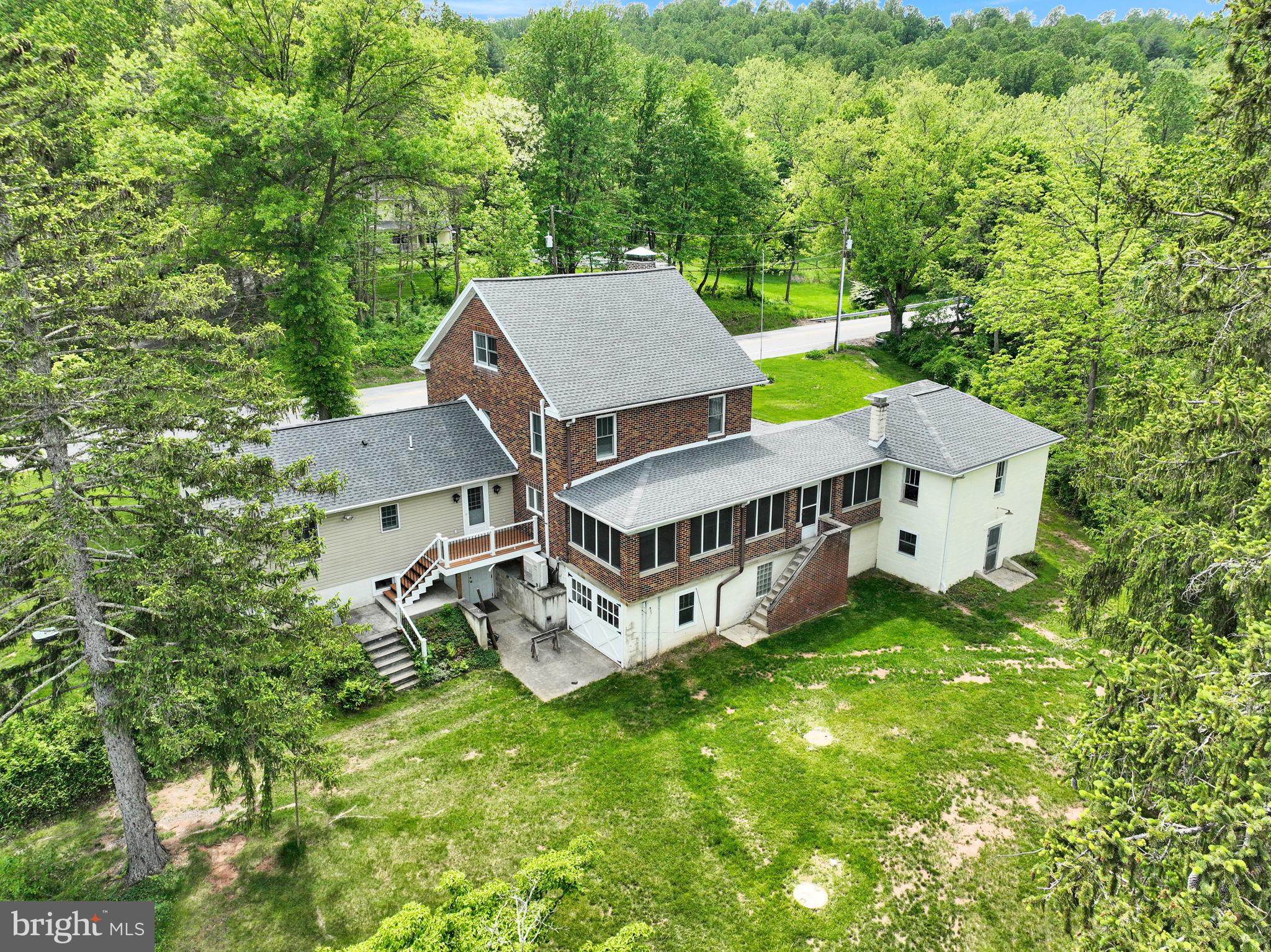 1037 Siddonsburg Road Lewisberry, PA 17339 - Photo 53 of 61 an aerial view of a house with a big yard and large trees