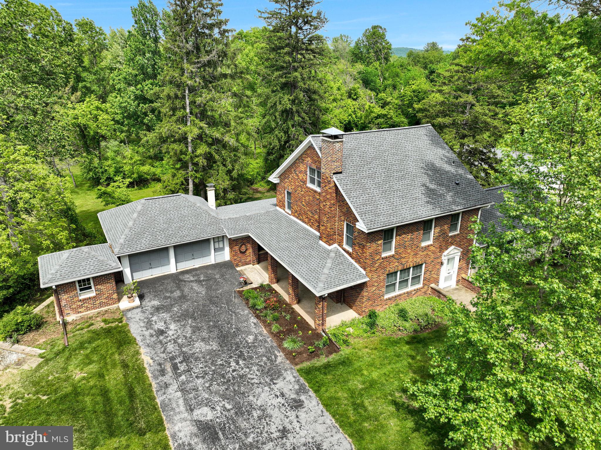 1037 Siddonsburg Road Lewisberry, PA 17339 - Photo 54 of 61 an aerial view of a house with a yard and trees all around
