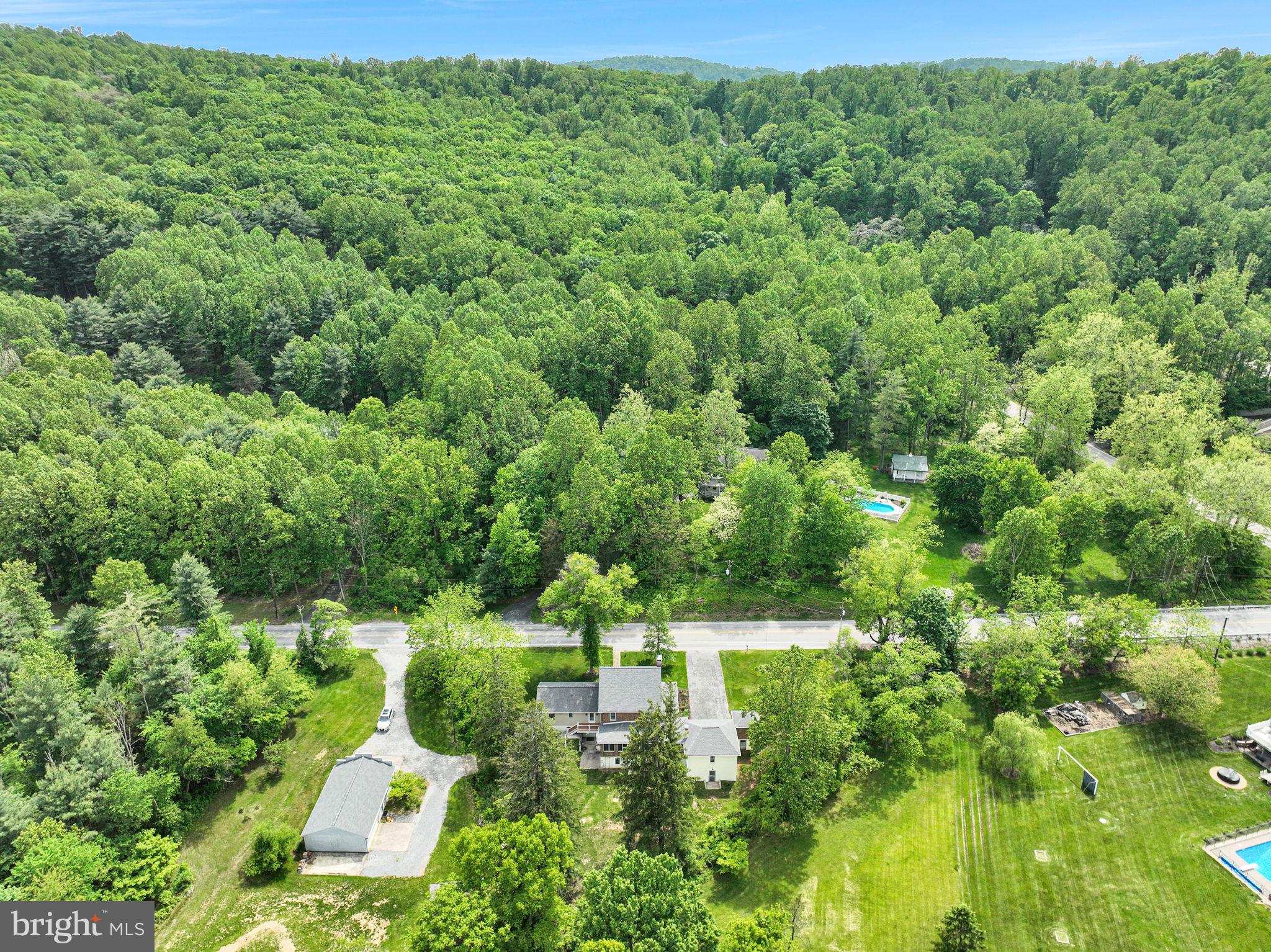 1037 Siddonsburg Road Lewisberry, PA 17339 - Photo 56 of 61 a view of a garden with a building in the background