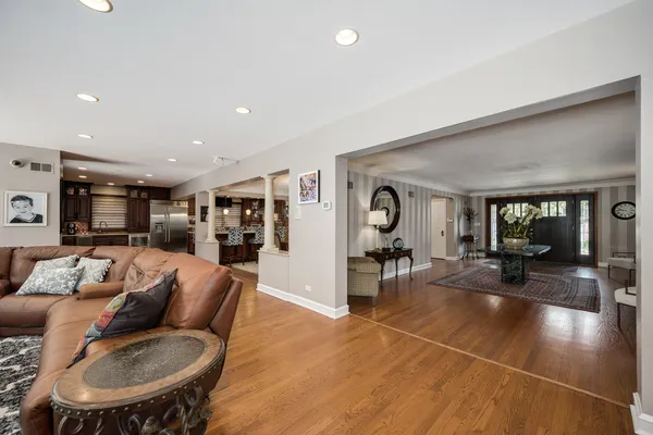 a large kitchen with a table and chairs