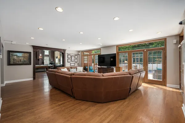 a very nice looking living room with a large window and a fireplace