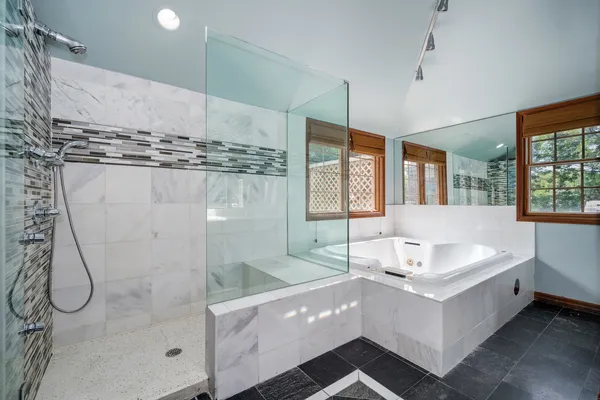 a view of a livingroom with a fireplace and a workspace