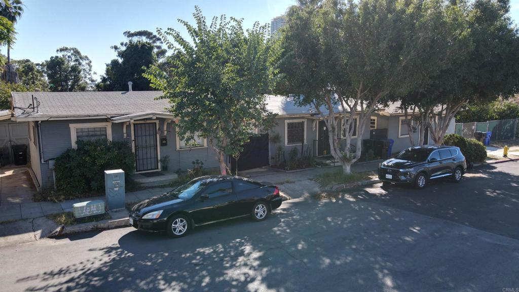 1901 E Street San Diego, CA 92102 - Photo 7 of 7 a view of a house with a yard fire pit and outdoor seating