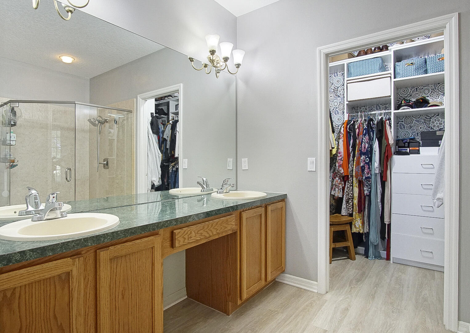 1581 Southwest Harbour Isles Circle, Unit 58 Port St. Lucie, FL 34986 - Photo 12 of 38 a bathroom with a double vanity sink and a mirror