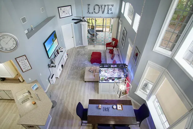 a living room with furniture and a flat screen tv