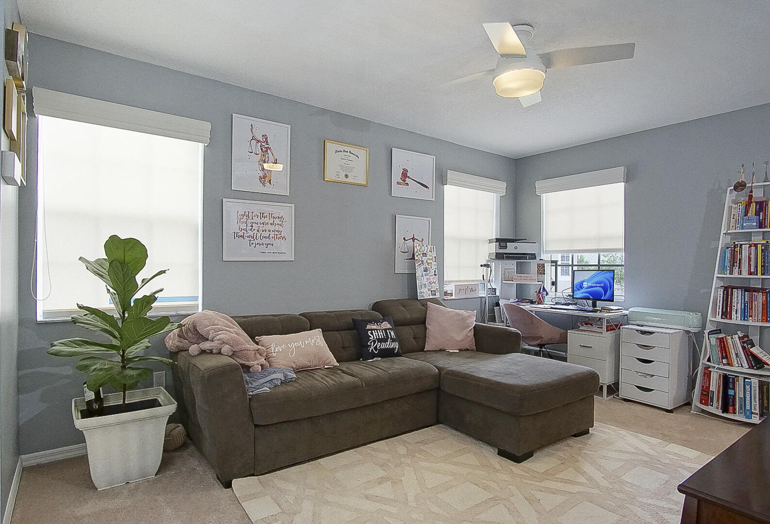1581 Southwest Harbour Isles Circle, Unit 58 Port St. Lucie, FL 34986 - Photo 19 of 38 a living room with furniture potted plant and a window