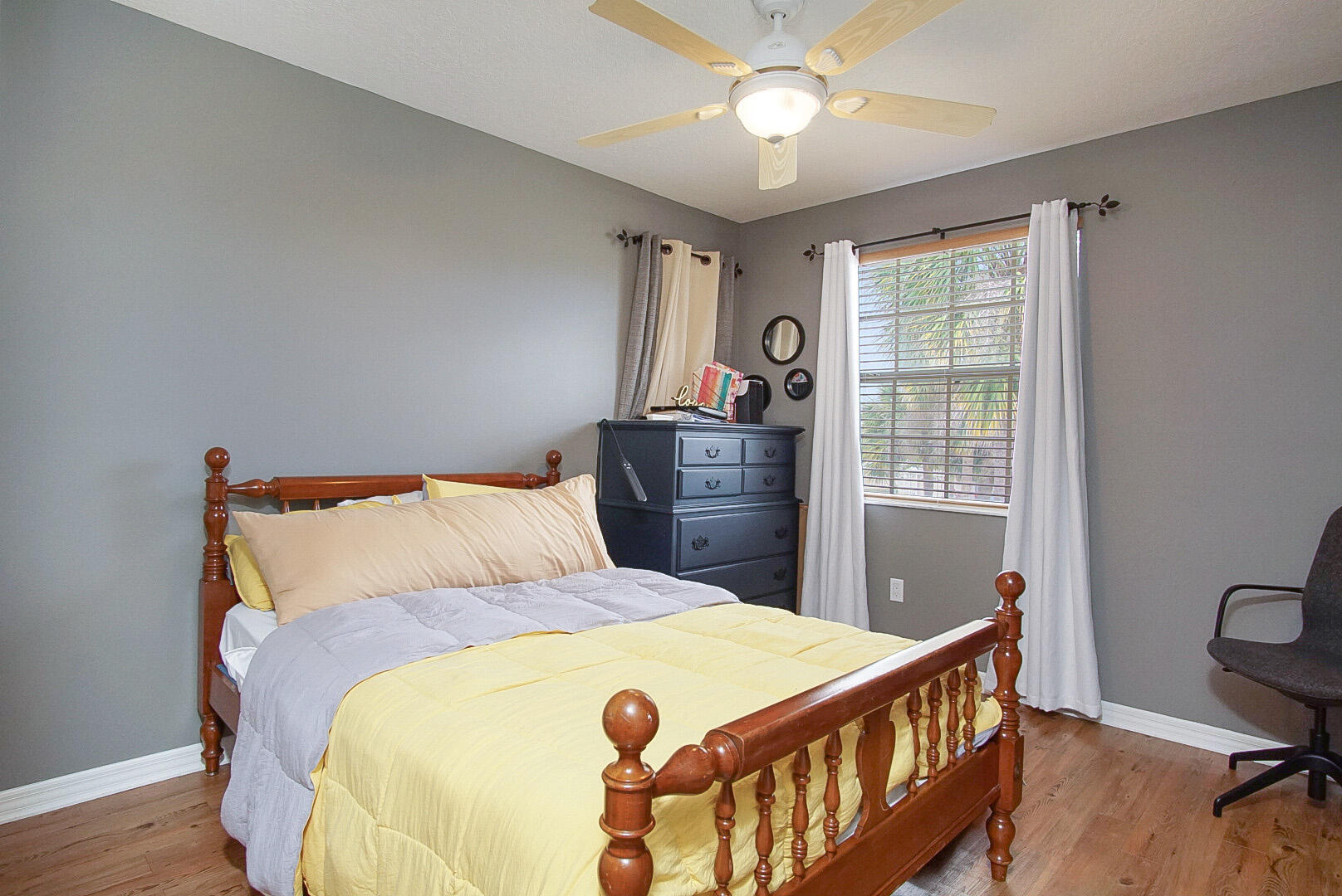 1581 Southwest Harbour Isles Circle, Unit 58 Port St. Lucie, FL 34986 - Photo 22 of 38 a bed sitting in a bedroom next to a window