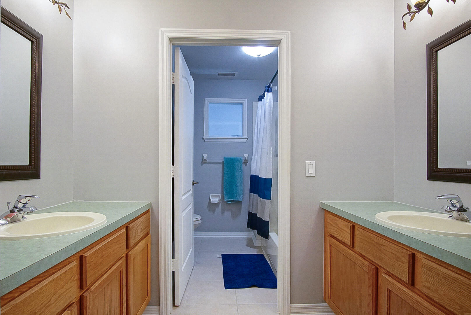 1581 Southwest Harbour Isles Circle, Unit 58 Port St. Lucie, FL 34986 - Photo 23 of 38 a bathroom with a sink and a mirror