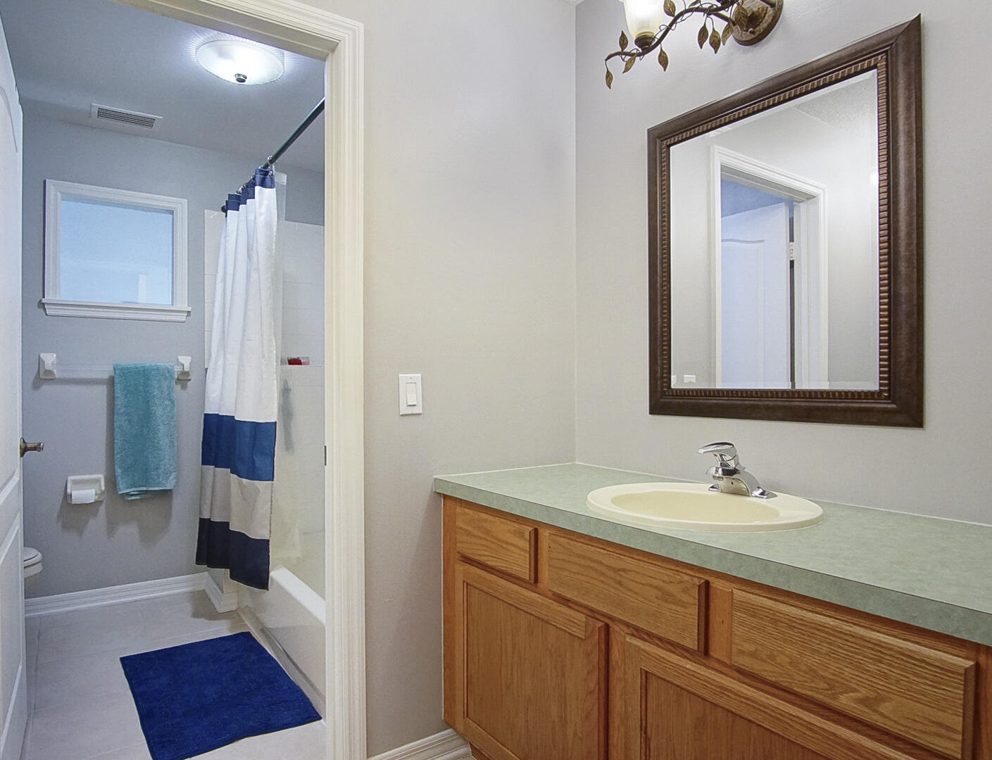 1581 Southwest Harbour Isles Circle, Unit 58 Port St. Lucie, FL 34986 - Photo 24 of 38 a bathroom with a sink a toilet and shower