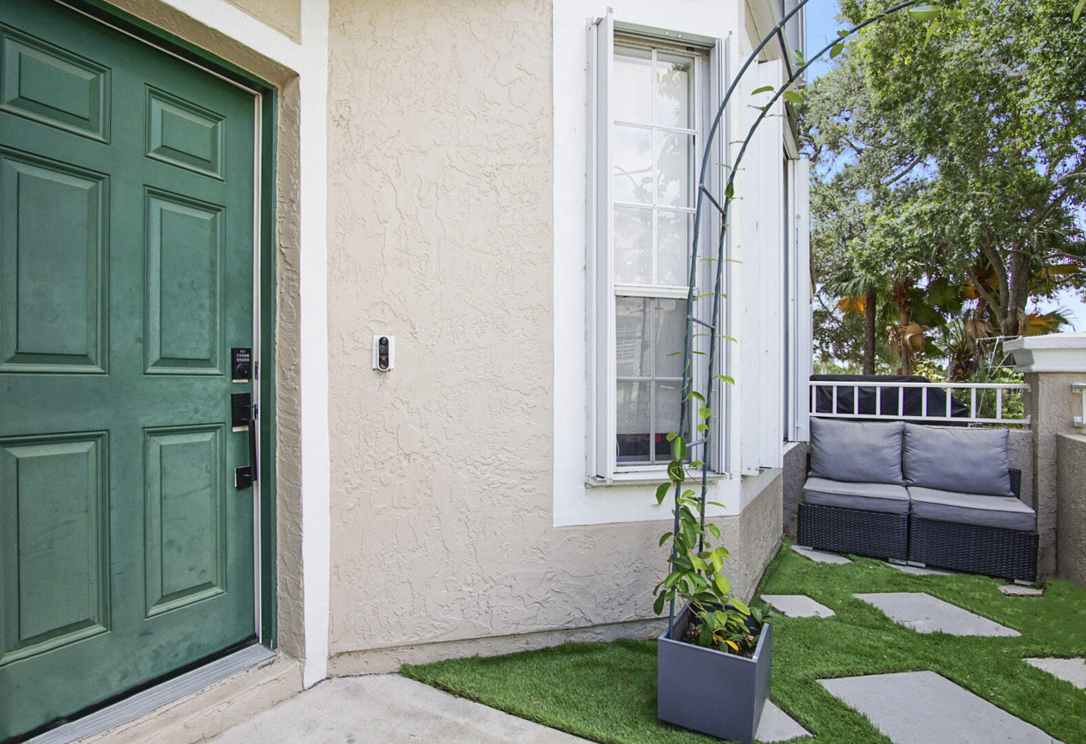 1581 Southwest Harbour Isles Circle, Unit 58 Port St. Lucie, FL 34986 - Photo 25 of 38 a view of yard from a corridor