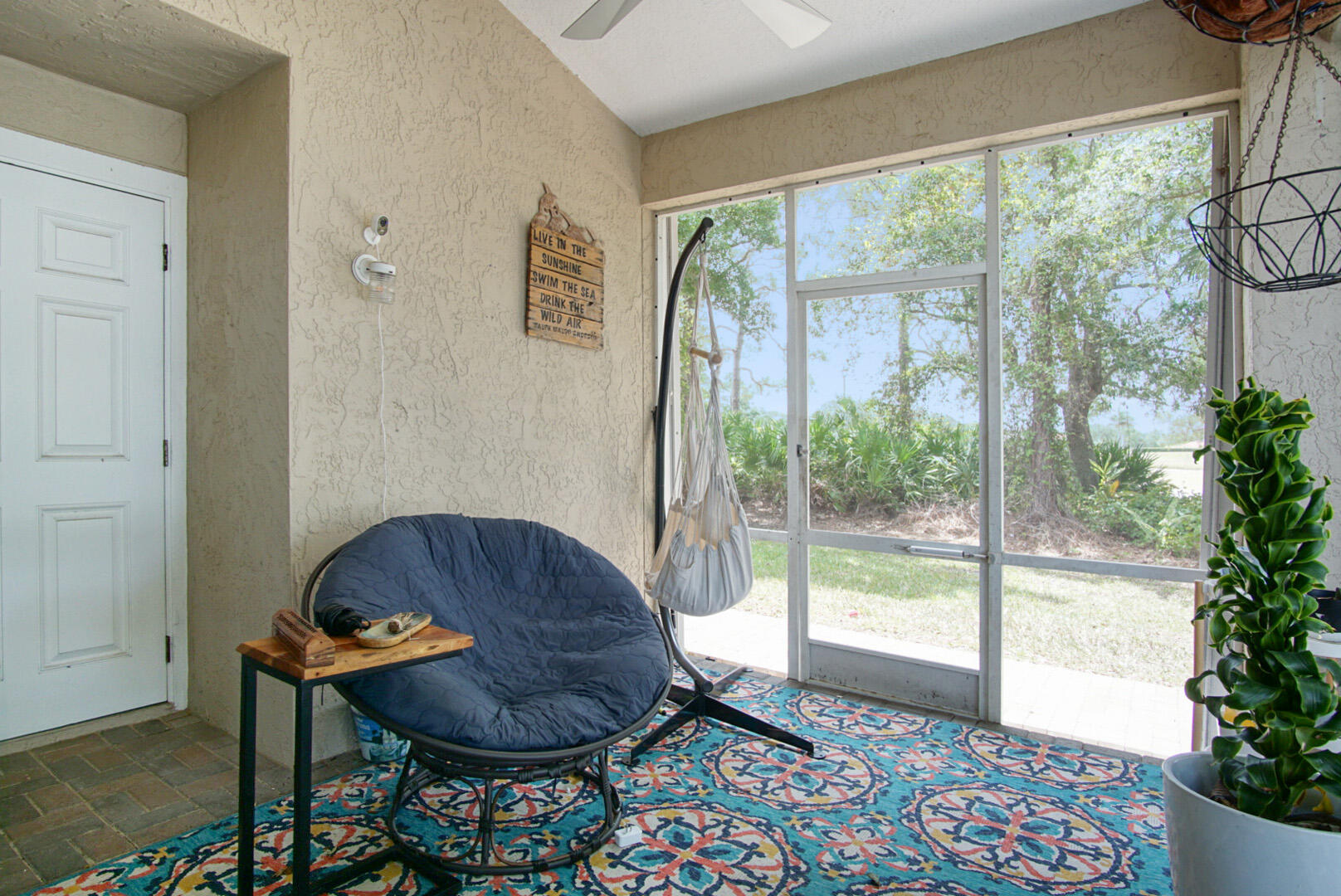 1581 Southwest Harbour Isles Circle, Unit 58 Port St. Lucie, FL 34986 - Photo 27 of 38 a room with furniture and a floor to ceiling window