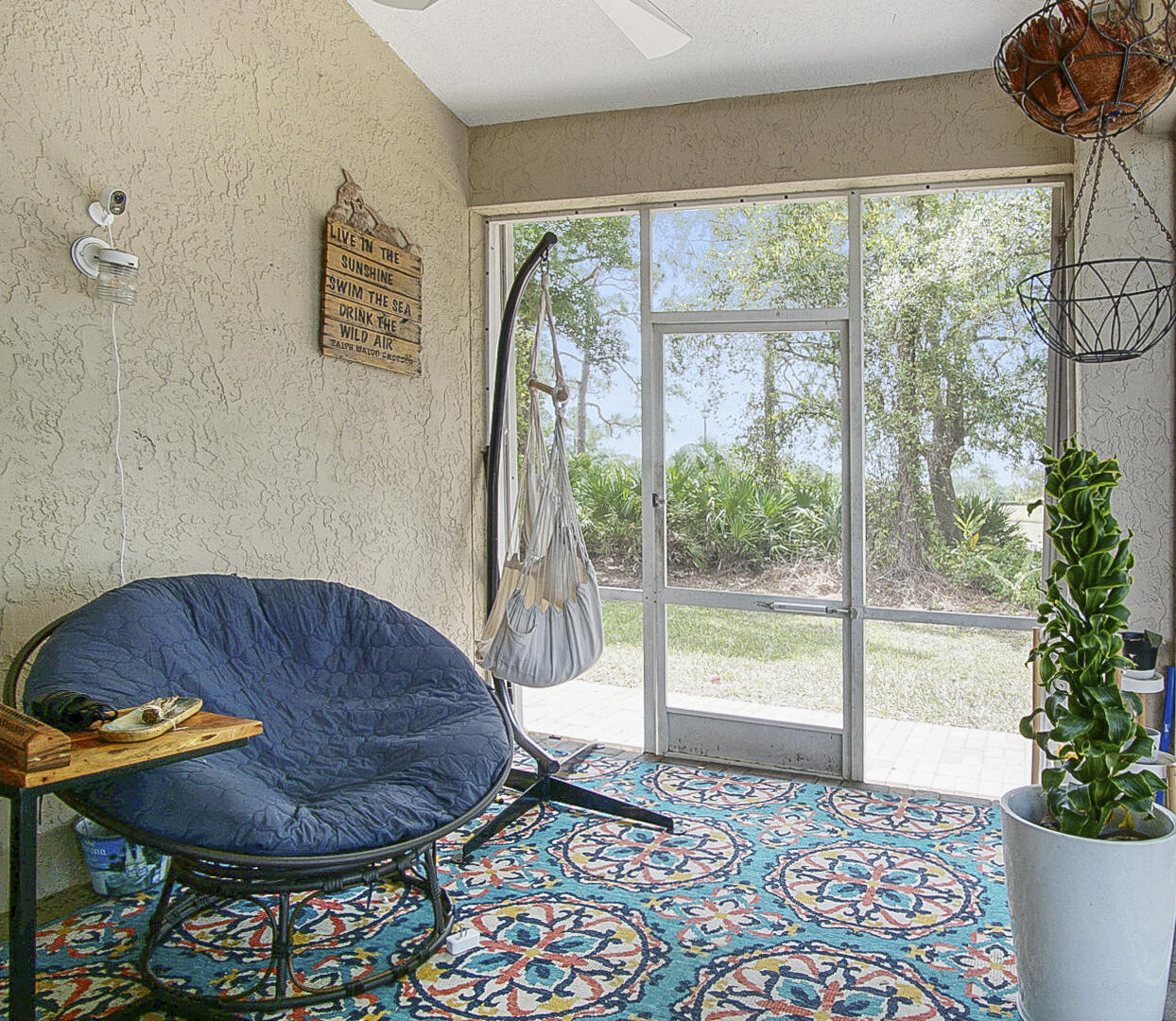 1581 Southwest Harbour Isles Circle, Unit 58 Port St. Lucie, FL 34986 - Photo 28 of 38 a living room with a couch and a table