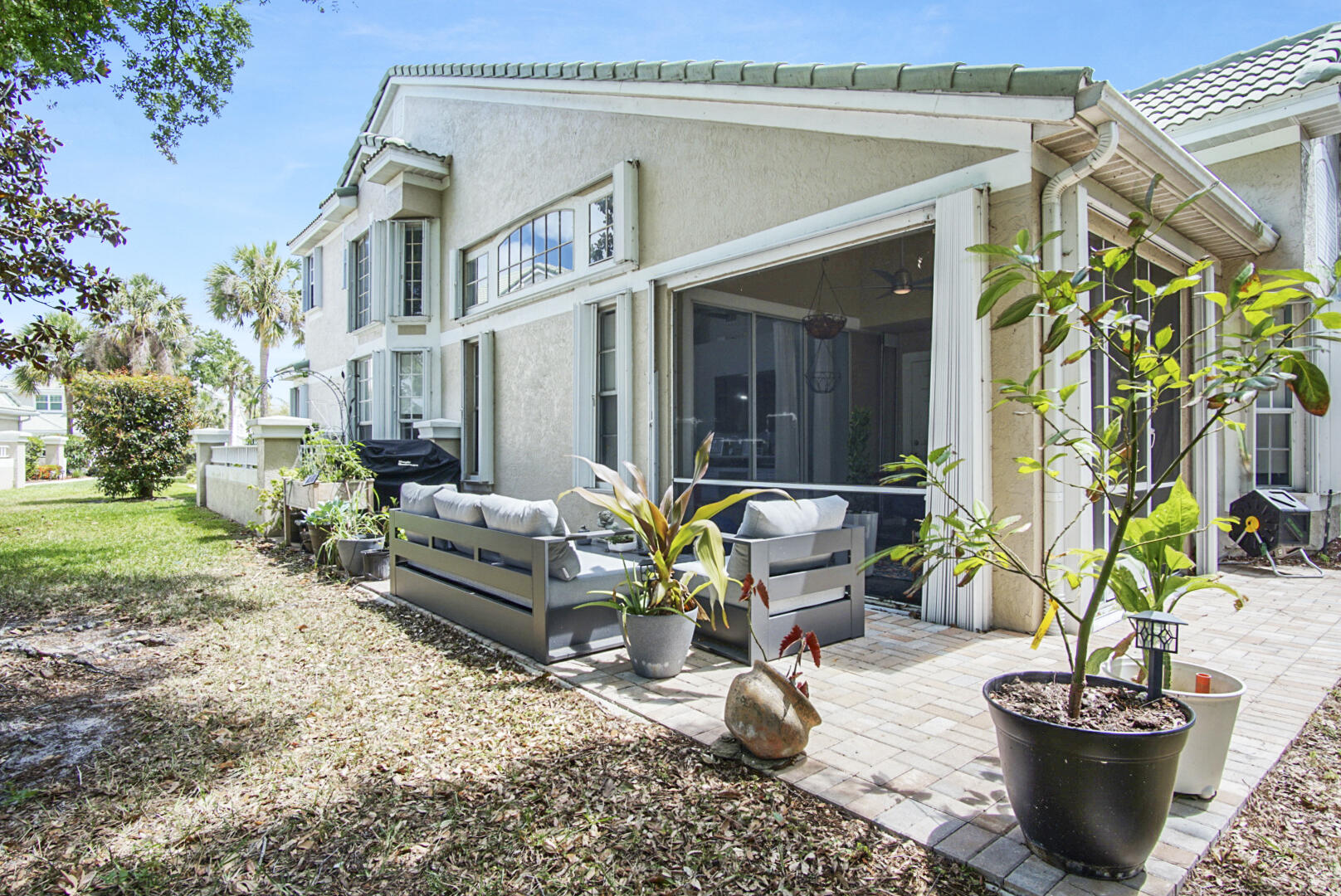 1581 Southwest Harbour Isles Circle, Unit 58 Port St. Lucie, FL 34986 - Photo 29 of 38 a view of a house with backyard and sitting area