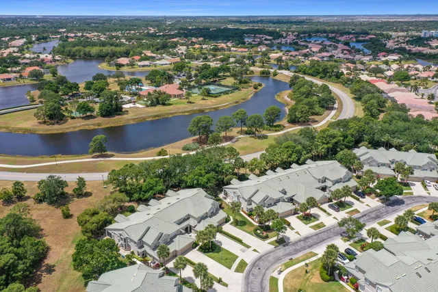 an aerial view of residential houses with outdoor space