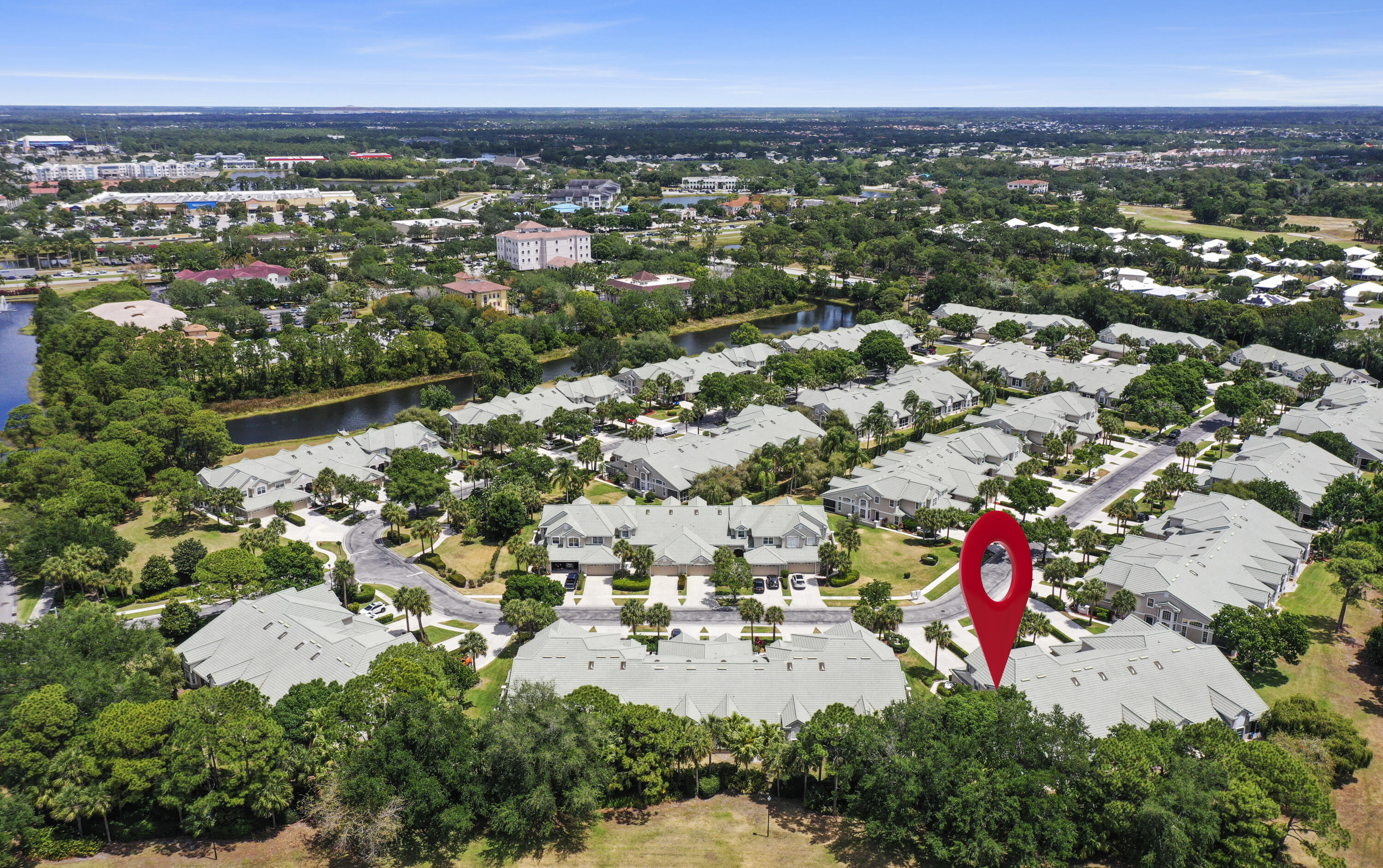 1581 Southwest Harbour Isles Circle, Unit 58 Port St. Lucie, FL 34986 - Photo 38 of 38 an aerial view of residential houses with outdoor space