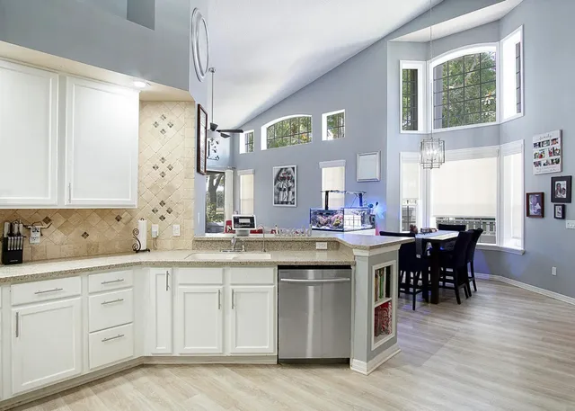 a kitchen with a sink and cabinets