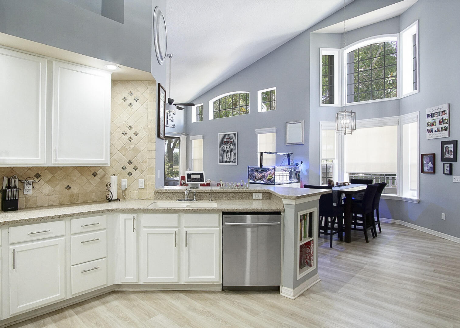 1581 Southwest Harbour Isles Circle, Unit 58 Port St. Lucie, FL 34986 - Photo 4 of 38 a kitchen with a sink and cabinets