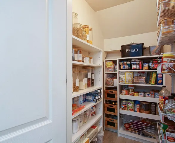 a shelf with books and knick knacks on it