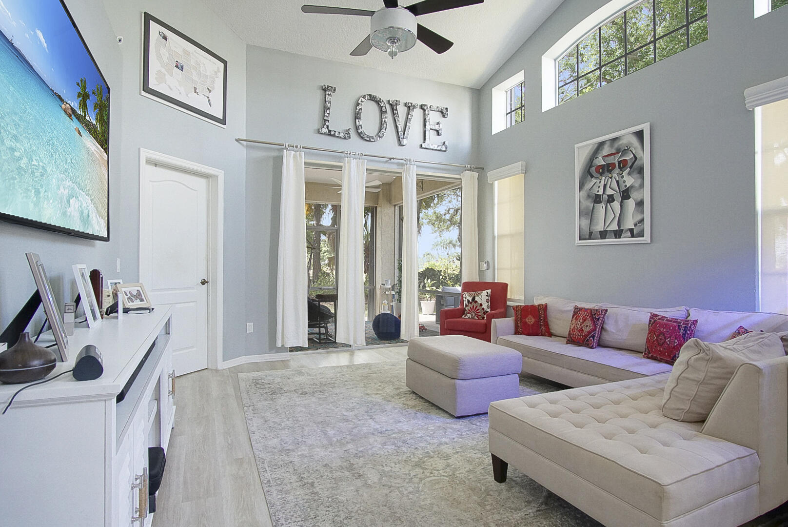 1581 Southwest Harbour Isles Circle, Unit 58 Port St. Lucie, FL 34986 - Photo 8 of 38 a living room with furniture and a flat screen tv