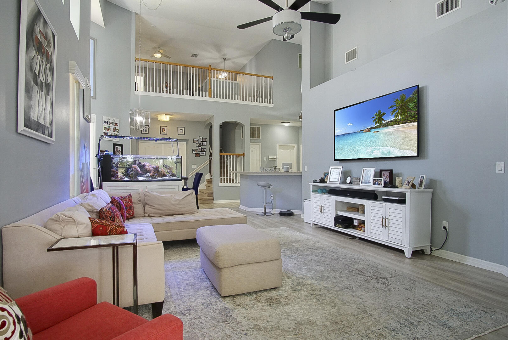 1581 Southwest Harbour Isles Circle, Unit 58 Port St. Lucie, FL 34986 - Photo 9 of 38 a living room with furniture and a flat screen tv