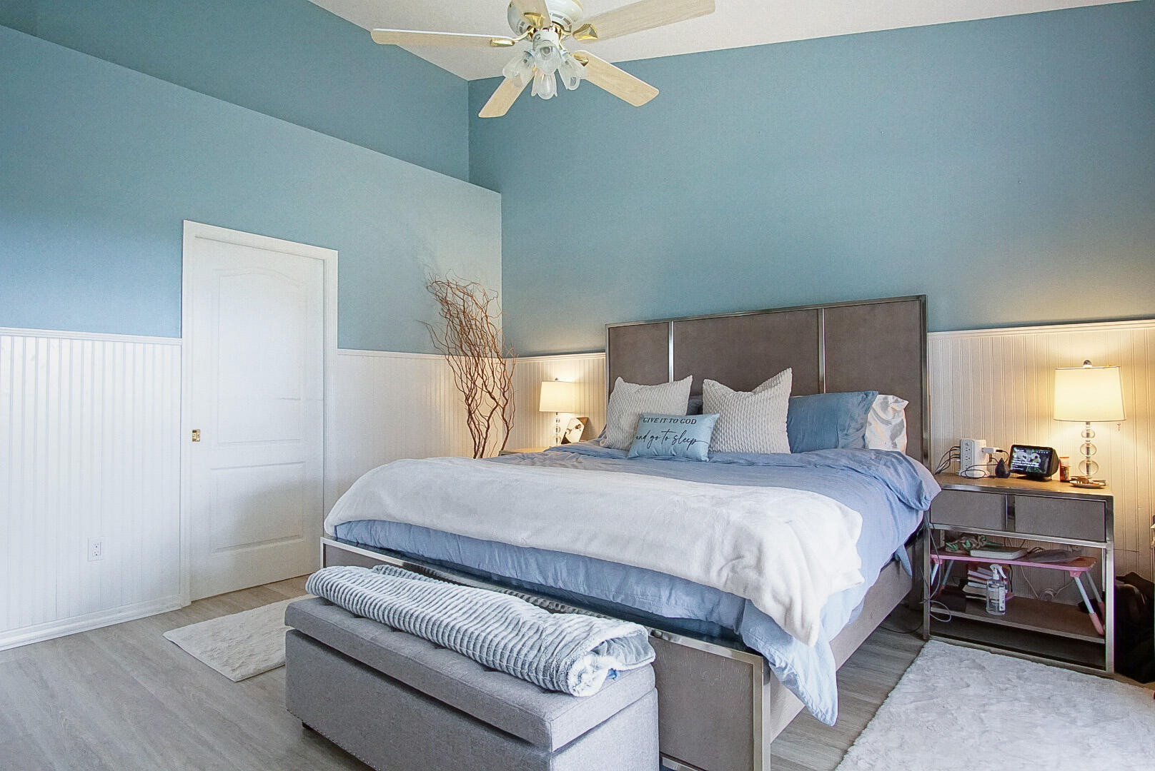 1581 Southwest Harbour Isles Circle, Unit 58 Port St. Lucie, FL 34986 - Photo 10 of 38 a bedroom with a bed and a chandelier