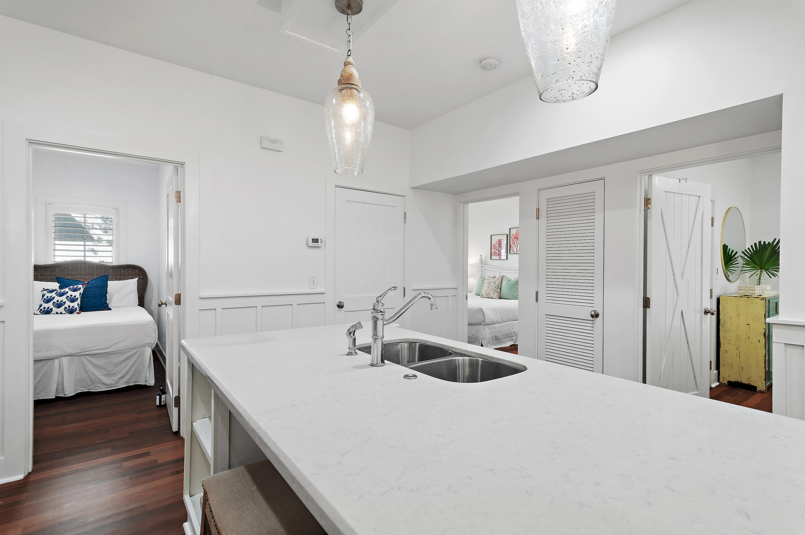 18 Olivia Lane Inlet Beach, FL 32461 - Photo 17 of 44 a spacious bedroom with a bed and a chandelier