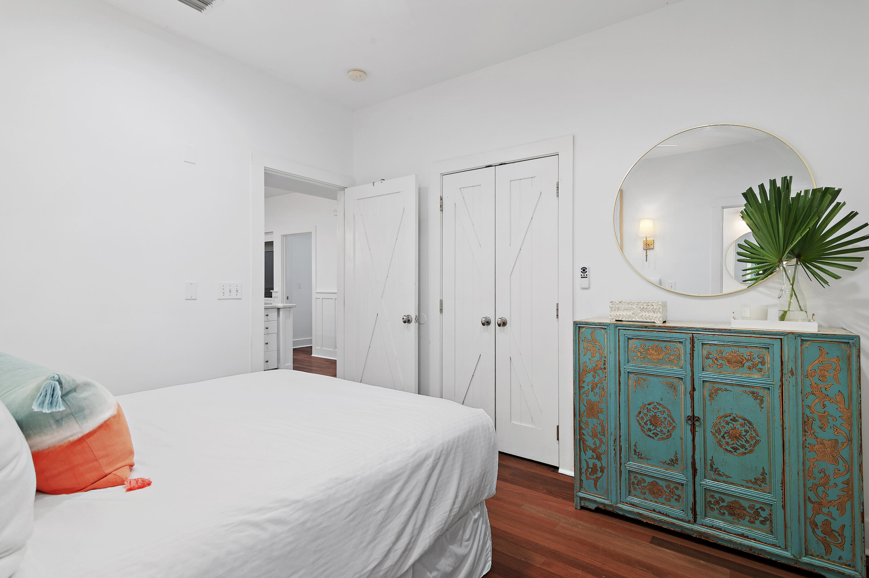 18 Olivia Lane Inlet Beach, FL 32461 - Photo 28 of 44 a bedroom with a bed a mirror and a potted plant