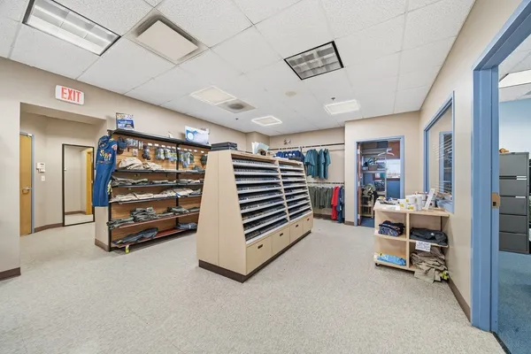 a room with a desk and workspace
