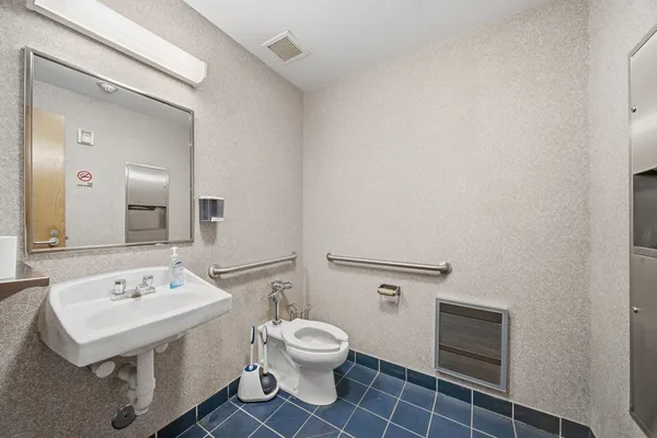a view of a storage & utility room with closet dryer