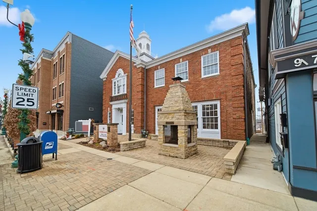 a view of a cars is parked in front of a house
