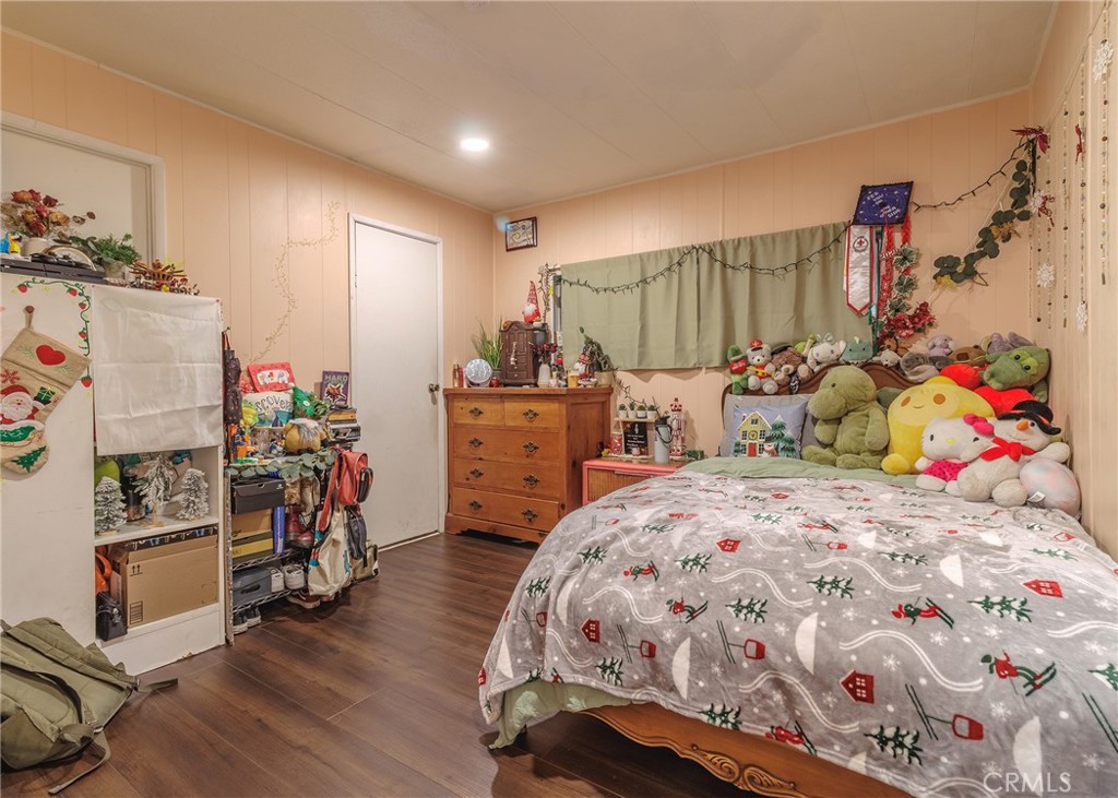 1616 South Euclid Street Anaheim, CA 92804 - Photo 12 of 22 a bedroom with bed and a baby crib