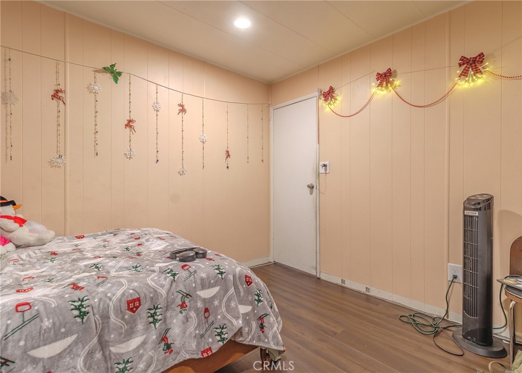 1616 South Euclid Street Anaheim, CA 92804 - Photo 13 of 22 a bedroom with a bed and a mirror