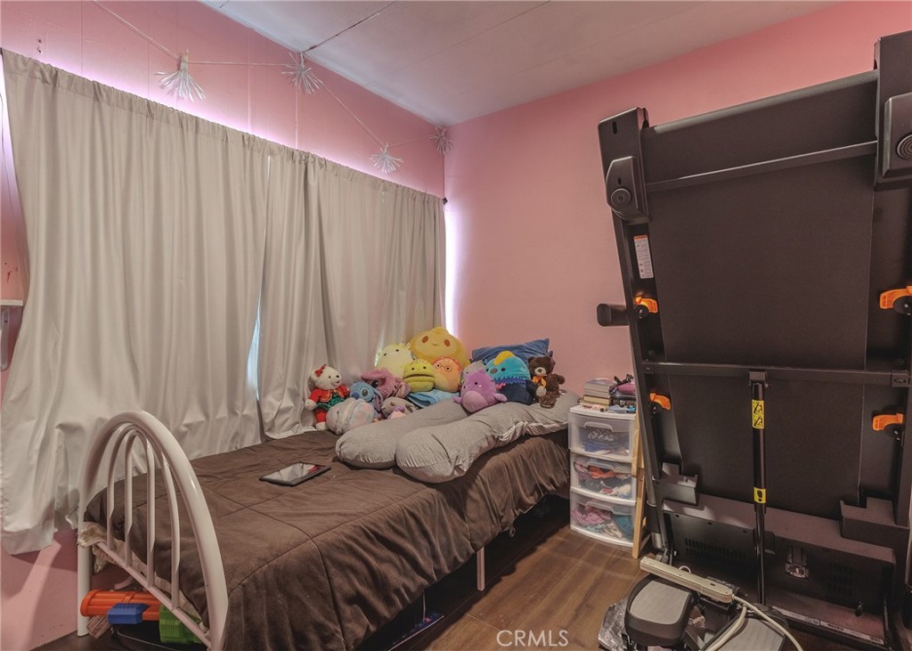 1616 South Euclid Street Anaheim, CA 92804 - Photo 14 of 22 a bedroom with a bed and furniture