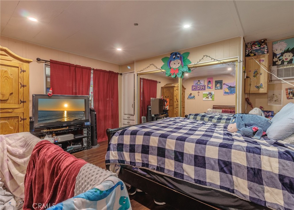 1616 South Euclid Street Anaheim, CA 92804 - Photo 16 of 22 a bedroom with a bed and flat screen tv