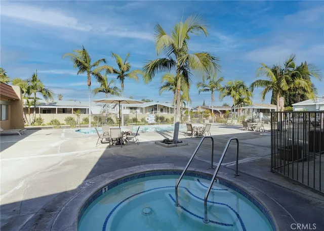 swimming pool view with outdoor seating