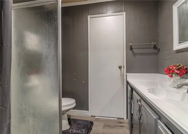 a white toilet sitting next to a shower curtain