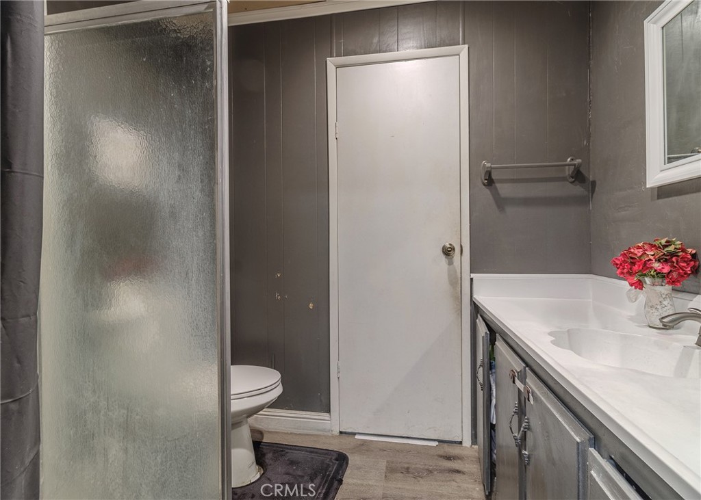 1616 South Euclid Street Anaheim, CA 92804 - Photo 9 of 22 a bathroom with a sink vanity and a mirror