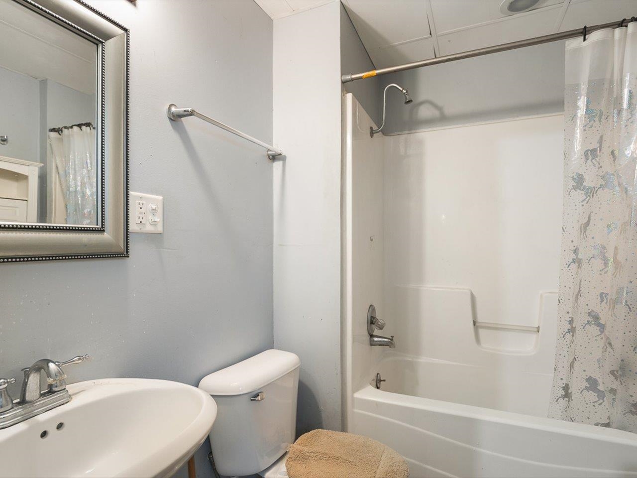 1247 West Logan Street Freeport, IL 61032 - Photo 24 of 34 a bathroom with a sink toilet and shower
