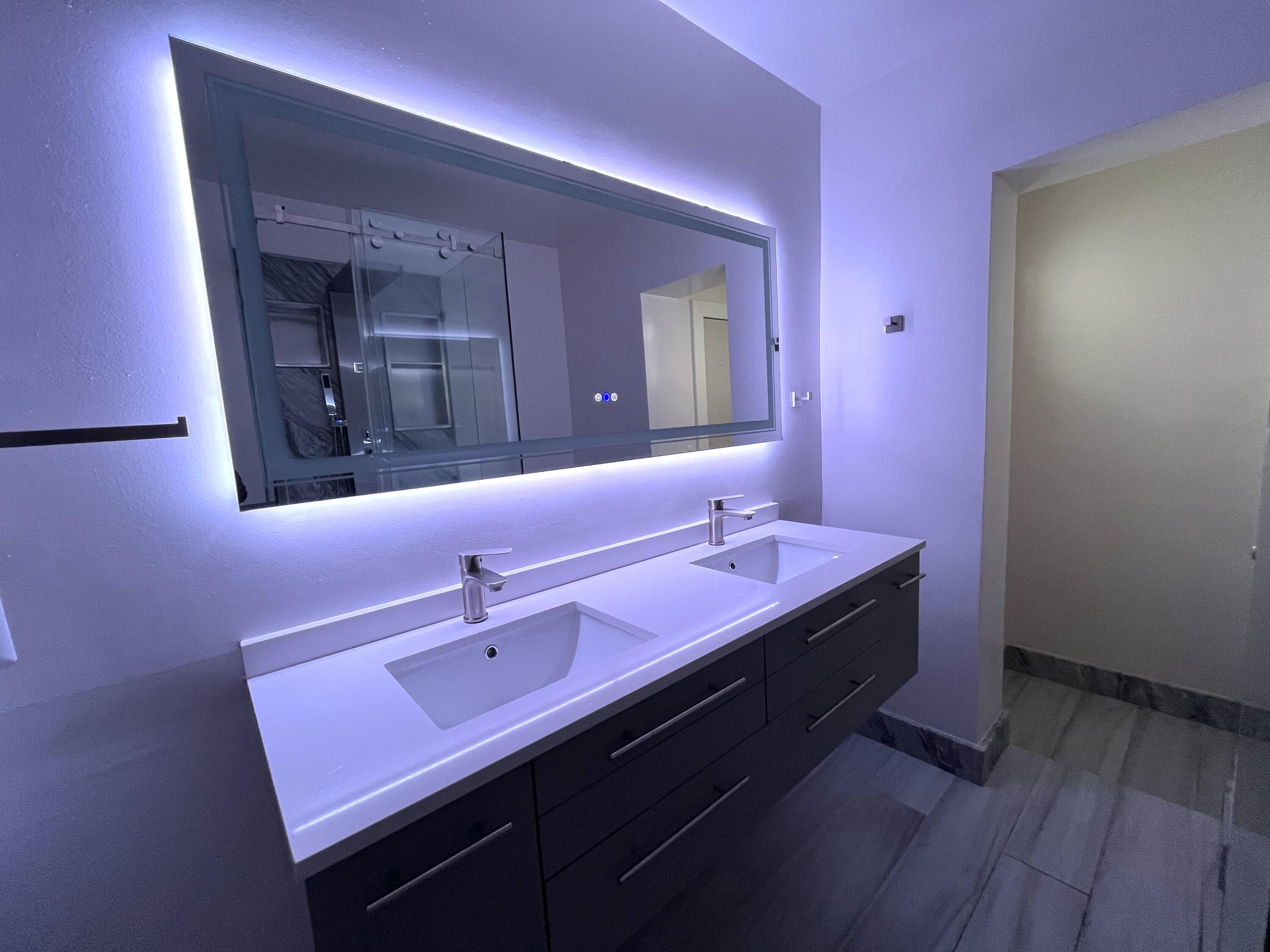 8760 Southwest 83rd Street Miami, FL 33173 - Photo 14 of 24 a bathroom with a sink and a mirror