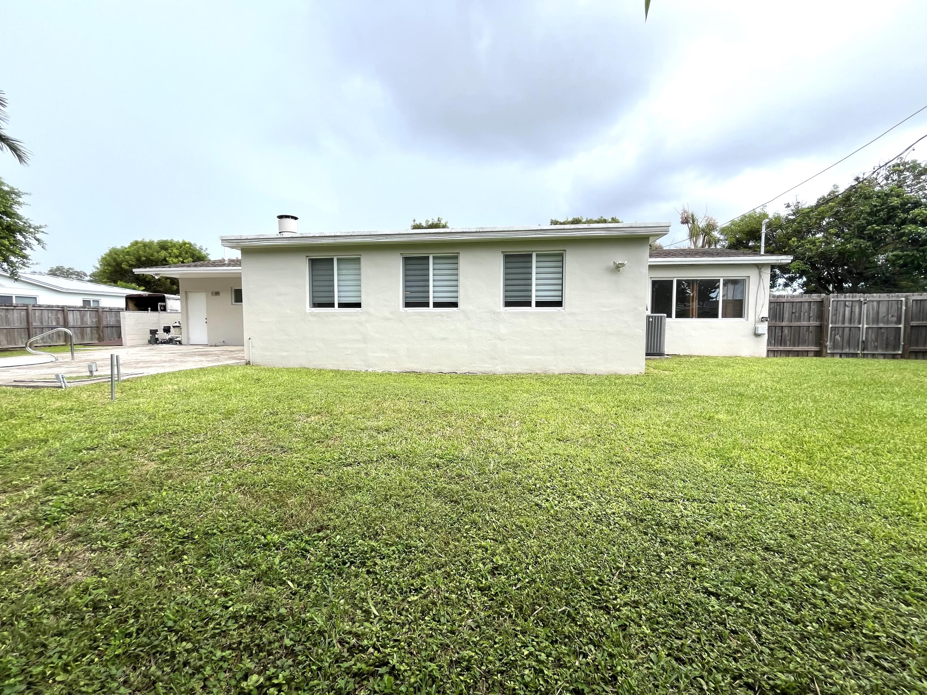 8760 Southwest 83rd Street Miami, FL 33173 - Photo 19 of 24 a front view of a house with garden
