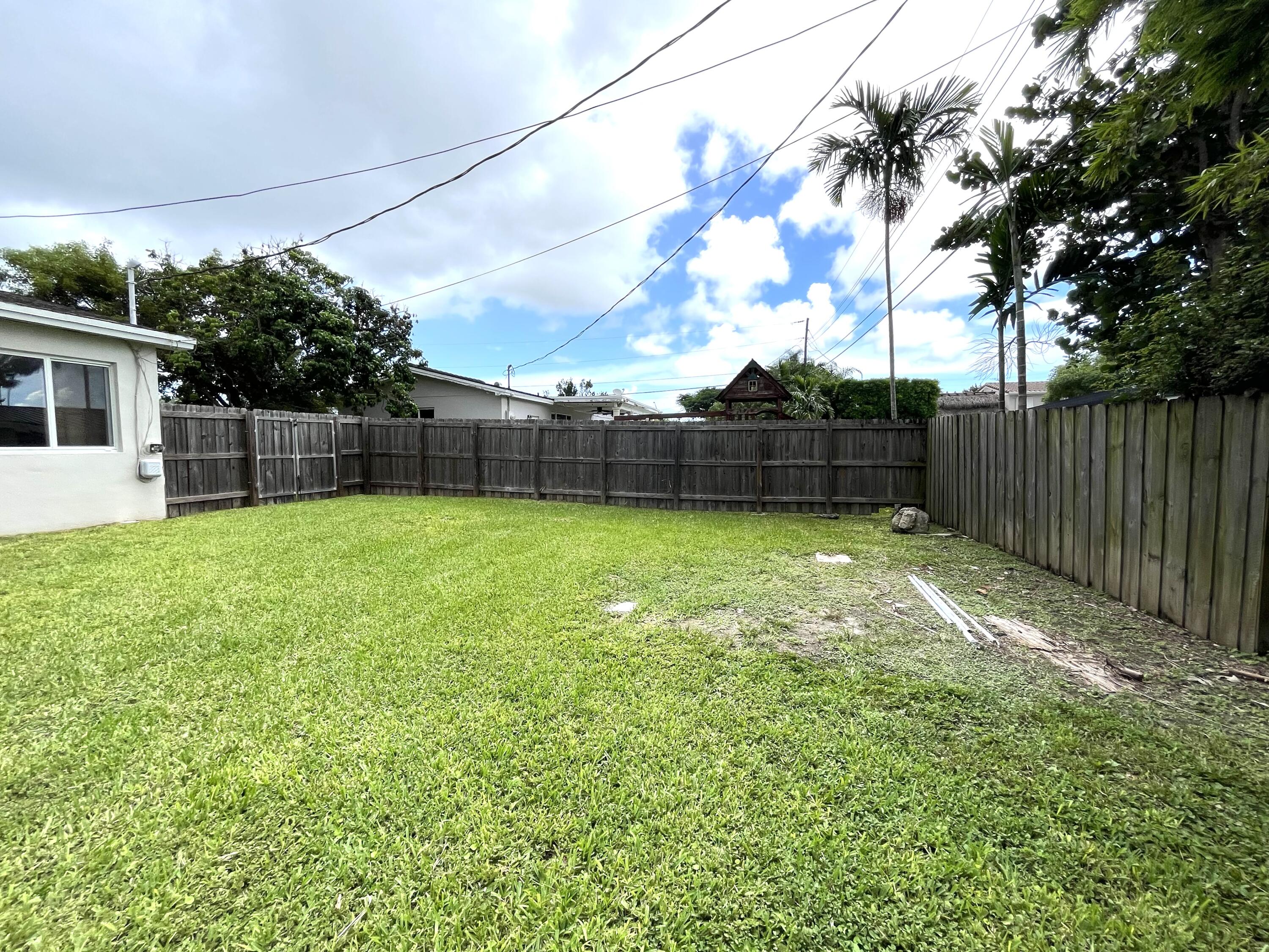 8760 Southwest 83rd Street Miami, FL 33173 - Photo 23 of 24 a view of a backyard with a garden