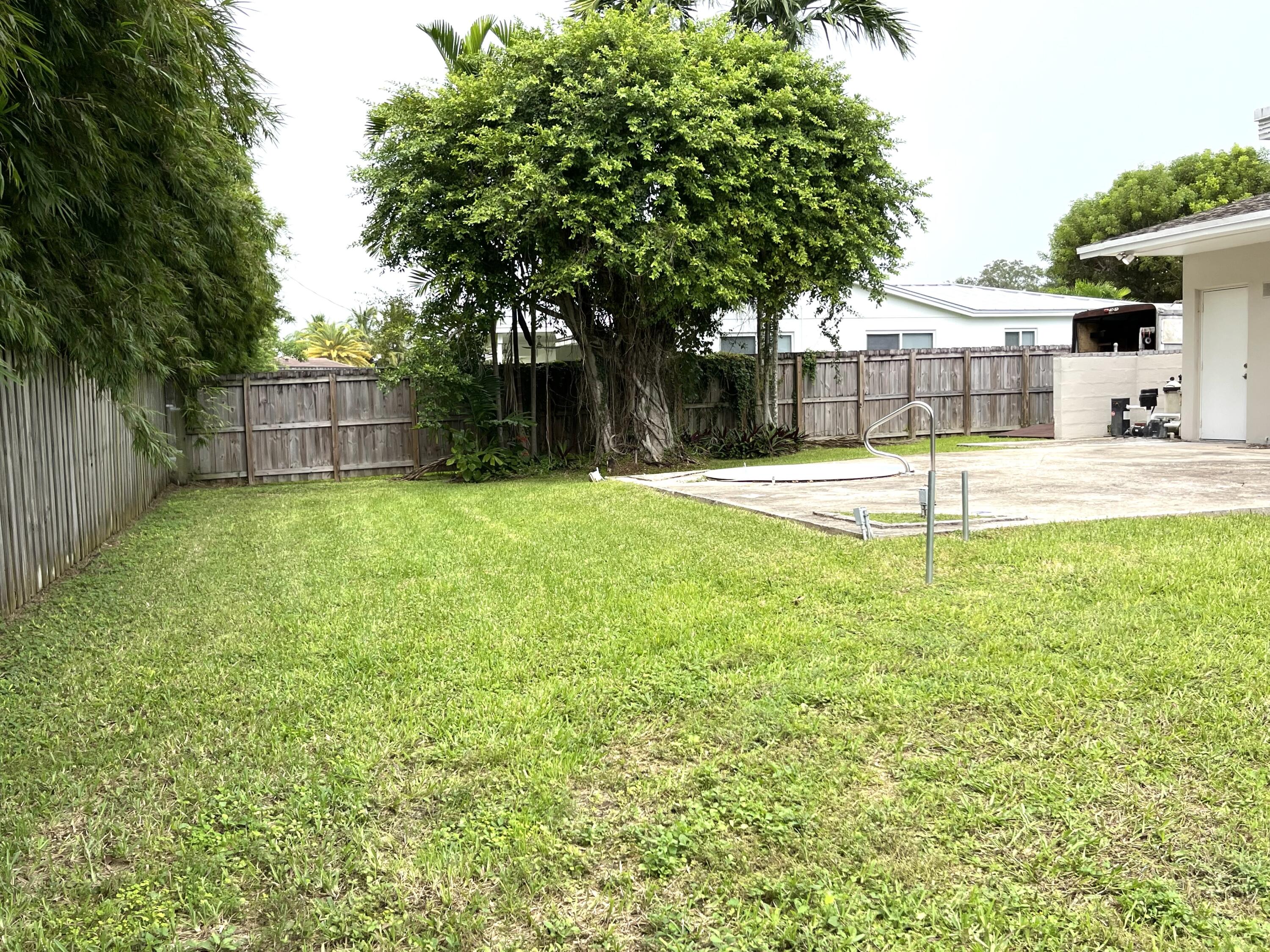 8760 Southwest 83rd Street Miami, FL 33173 - Photo 24 of 24 a view of a backyard with a small cabin