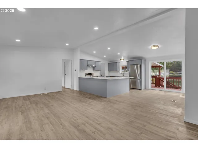 a view of kitchen with wooden floor