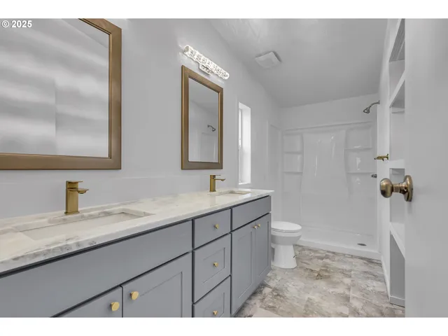 a view of storage and utility room with washer and dryer