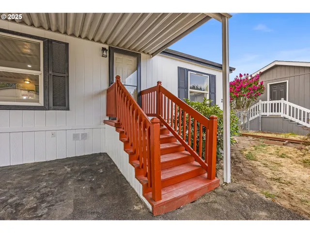 a picture of houses with outdoor space and lake view