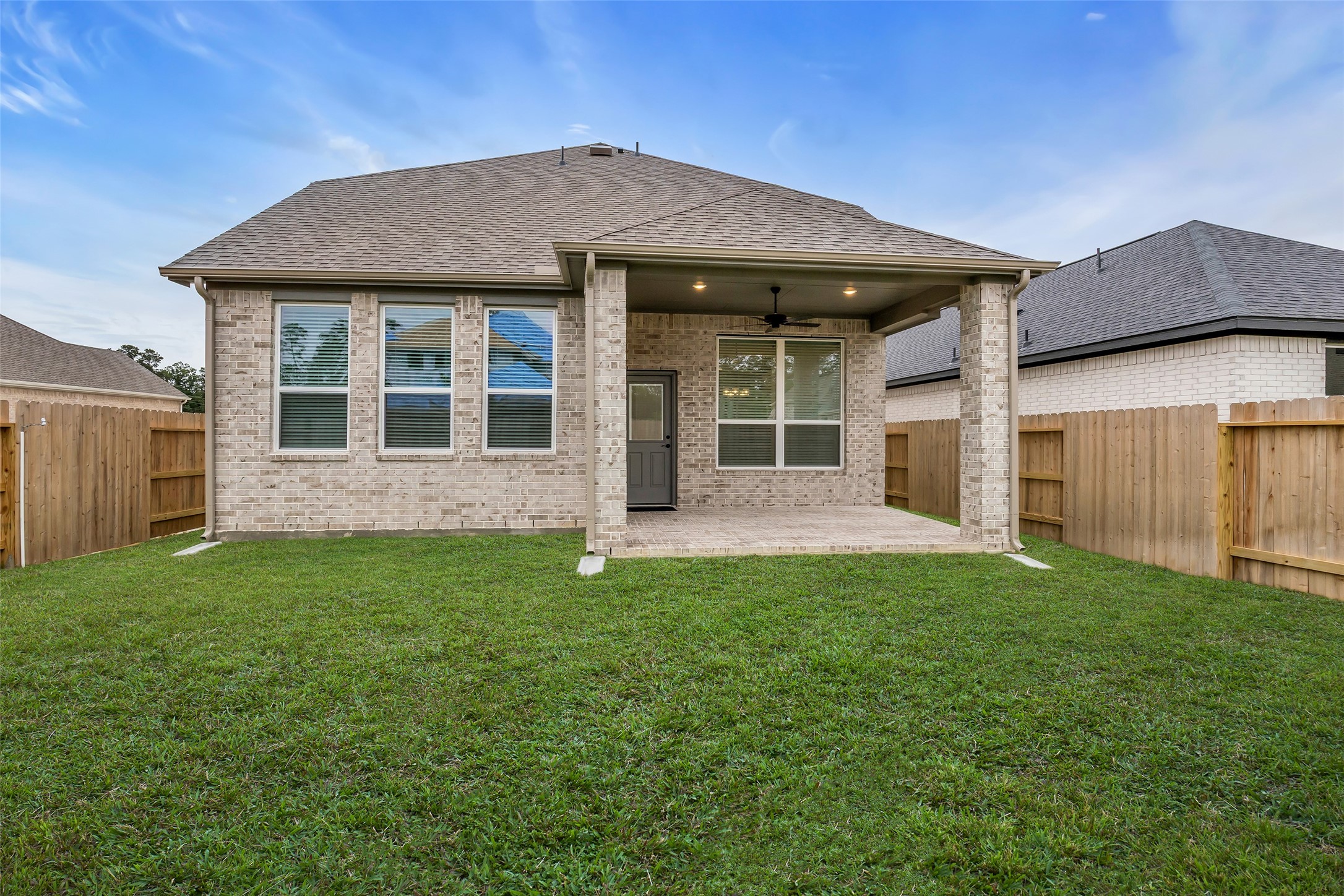 12853 Meadow Wind Way Conroe, TX 77302 - Photo 39 of 47 Large Covered Back Patio, with Gas grill stub out, ceiling fan and fenced backyard.