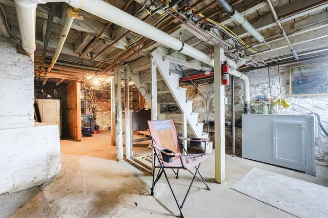 a view of a storage room with a table and chairs